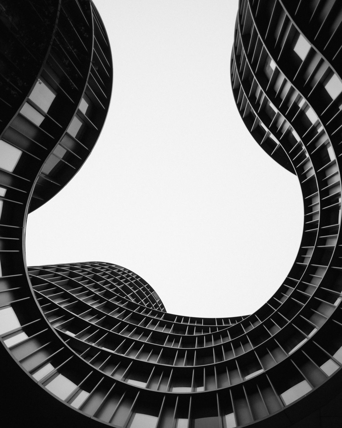 Curved facade of a modern building seen from below