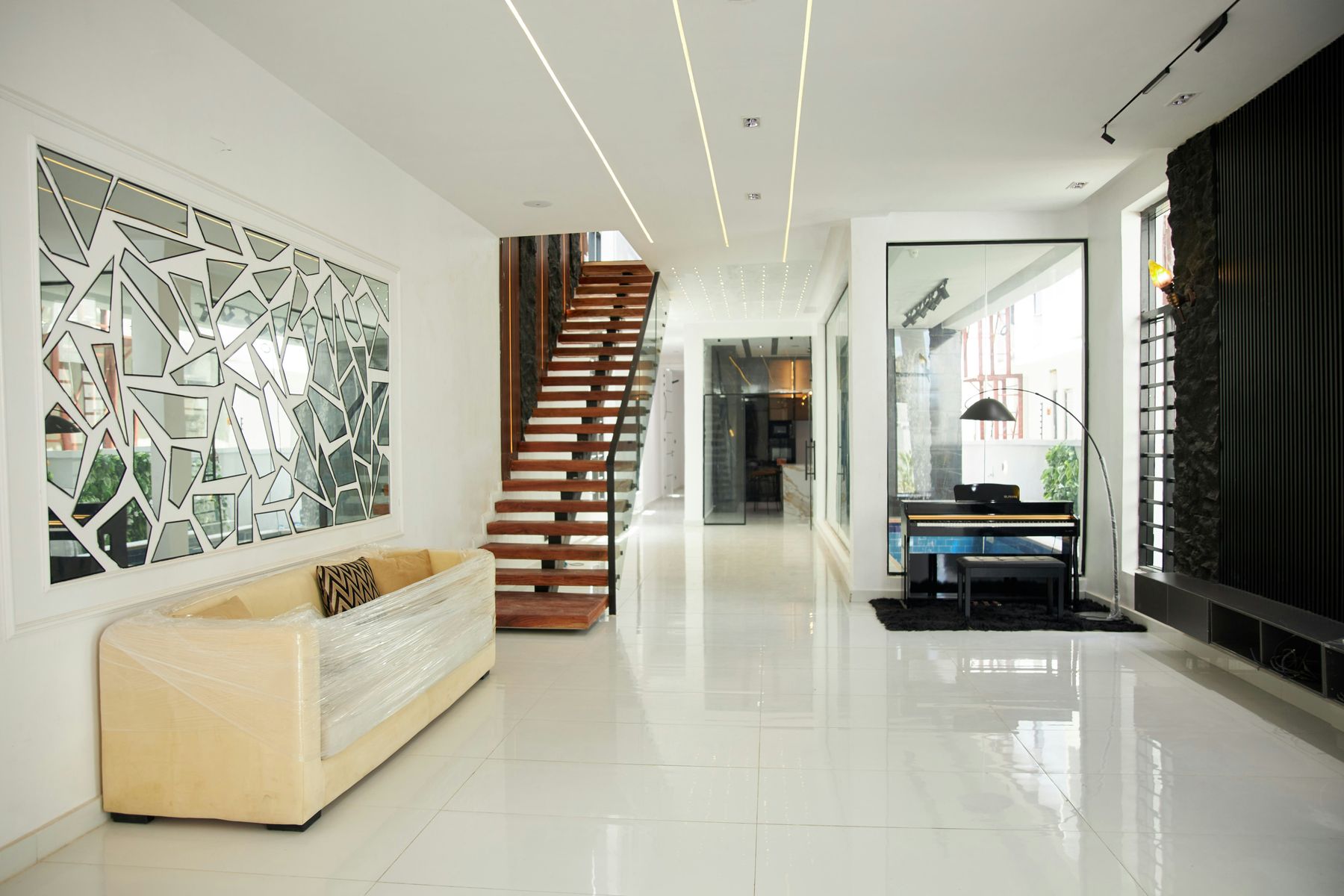 Refurbished interior with a timber staircase and glazed partitions